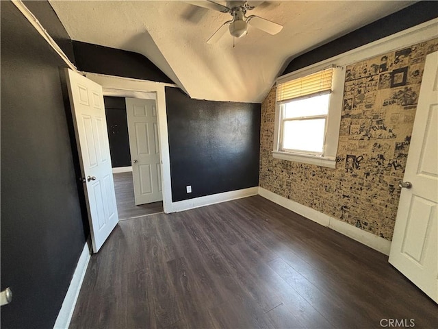 1646 Cimarron St, Los Angeles, CA 90019 - unfurnished bedroom with vaulted ceiling, dark wood-type flooring, and a ceiling fan