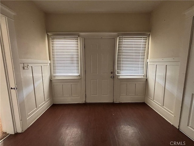 1646 Cimarron St, Los Angeles, CA 90019 - foyer featuring a wainscoted wall, dark wood finished floors, a decorative wall, and plenty of natural light