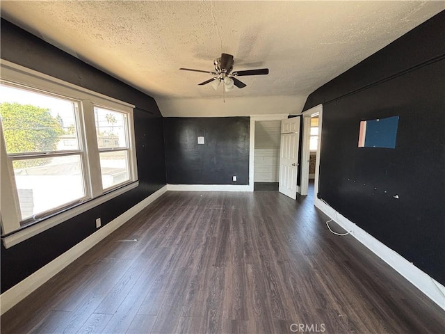 1646 Cimarron St, Los Angeles, CA 90019 - unfurnished room featuring ceiling fan, dark wood-type flooring, a textured ceiling, and lofted ceiling