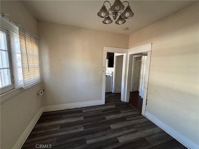 1646 Cimarron St, Los Angeles, CA 90019 - spare room featuring a chandelier and dark wood-type flooring