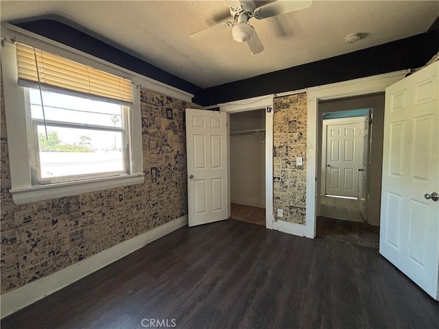 1646 Cimarron St, Los Angeles, CA 90019 - unfurnished bedroom with dark wood-type flooring, a closet, and ceiling fan