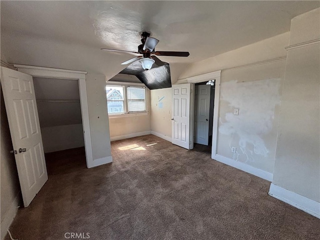 1646 Cimarron St, Los Angeles, CA 90019 - unfurnished bedroom featuring vaulted ceiling, carpet flooring, and ceiling fan