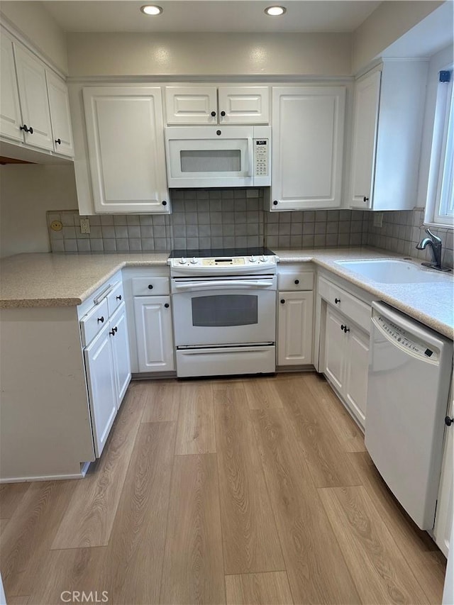 22943 Maple Ave Unit A, Torrance, CA 90505 - kitchen with white appliances, light wood-style flooring, white cabinetry, and recessed lighting