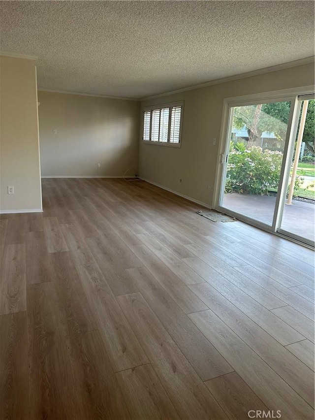 22943 Maple Ave Unit A, Torrance, CA 90505 - empty room featuring a textured ceiling and wood finished floors