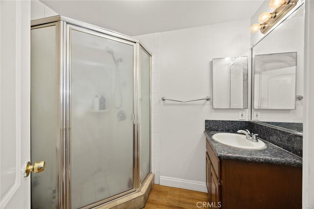 3453 Ivar Ave, Rosemead, CA 91770 - bathroom featuring vanity, a stall shower, and wood finished floors