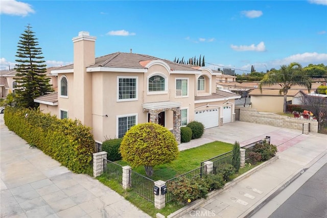 3453 Ivar Ave, Rosemead, CA 91770 - view of front of home featuring driveway, stucco siding, a fenced front yard, a chimney, and a tile roof