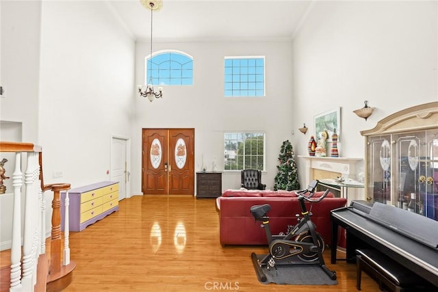 3453 Ivar Ave, Rosemead, CA 91770 - entryway featuring ornamental molding, light wood-style floors, and a high ceiling