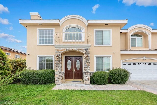 3453 Ivar Ave, Rosemead, CA 91770 - view of front of house featuring stucco siding, a front lawn, an attached garage, and driveway