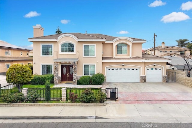 3453 Ivar Ave, Rosemead, CA 91770 - view of front of house featuring stucco siding, stone siding, a fenced front yard, concrete driveway, and a chimney