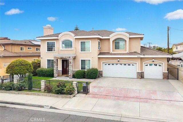 3453 Ivar Ave, Rosemead, CA 91770 - view of front of property with stucco siding, stone siding, a fenced front yard, and driveway