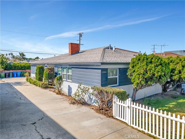 12961 Panama St, Los Angeles, CA 90066 - view of side of home featuring a chimney and a shingled roof