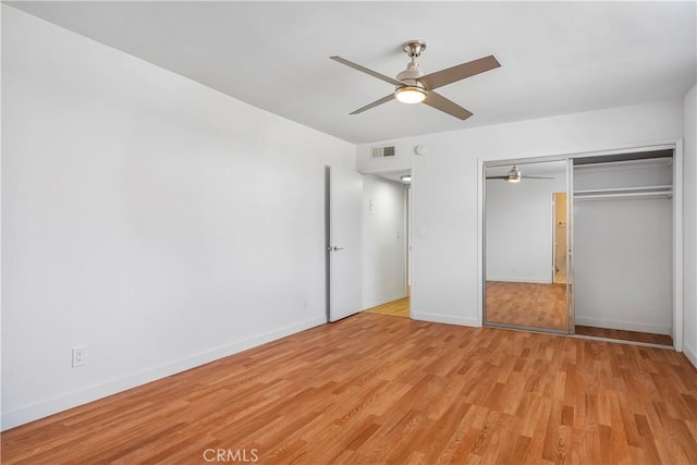 5429 Newcastle Ave Unit 309, Encino, CA 91316 - unfurnished bedroom featuring light wood-type flooring, a closet, and a ceiling fan