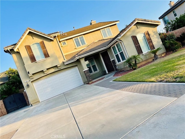 325 Deodar St, Redlands, CA 92374 - view of front of house featuring a gate, an attached garage, driveway, stucco siding, and a tiled roof