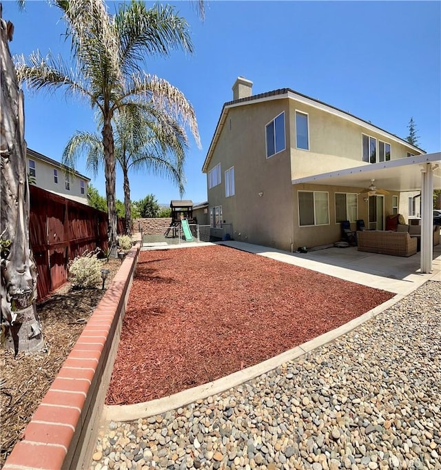 325 Deodar St, Redlands, CA 92374 - view of yard with a playground, a ceiling fan, an outdoor living space, and a patio area