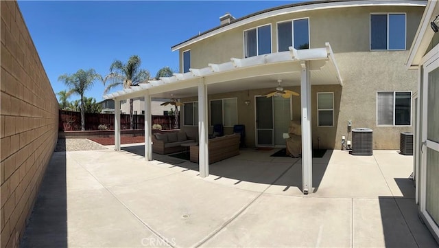 325 Deodar St, Redlands, CA 92374 - back of house featuring a ceiling fan, stucco siding, outdoor lounge area, a fenced backyard, and a patio