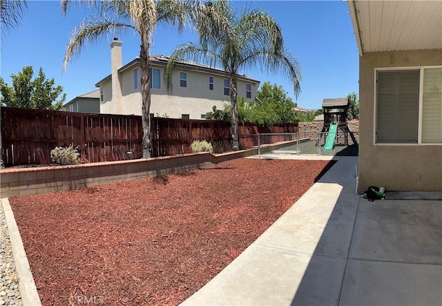 325 Deodar St, Redlands, CA 92374 - fenced backyard with a playground and a patio area