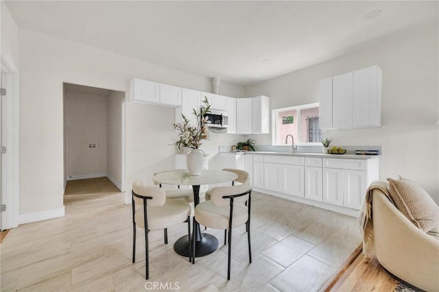 123 W 56th St, Los Angeles, CA 90037 - dining room featuring baseboards