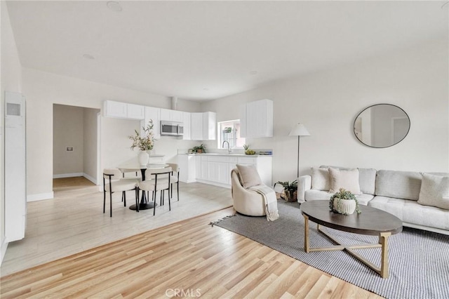 123 W 56th St, Los Angeles, CA 90037 - living area with light wood finished floors