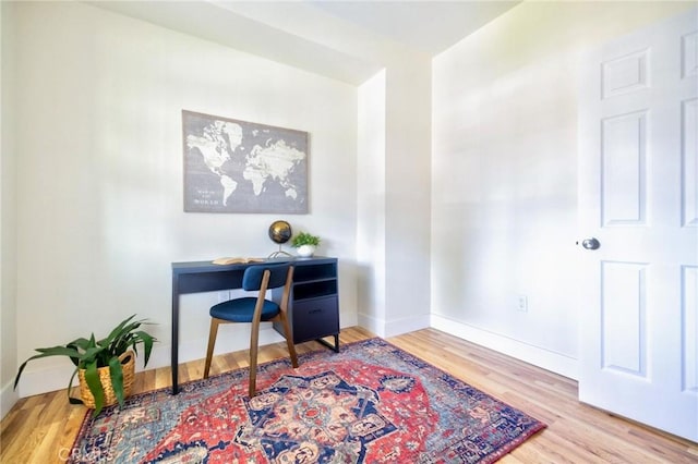 123 W 56th St, Los Angeles, CA 90037 - home office featuring wood finished floors