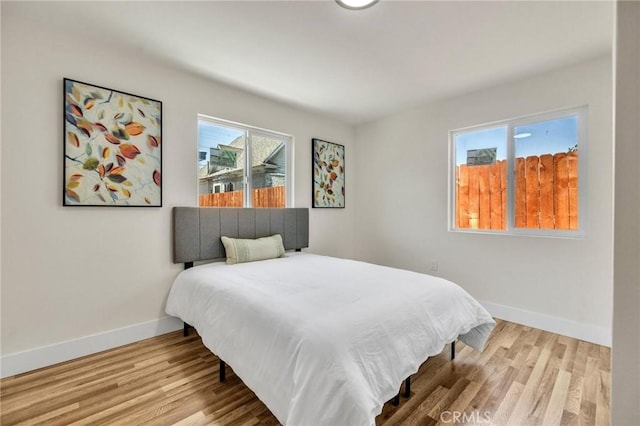 123 W 56th St, Los Angeles, CA 90037 - bedroom featuring wood finished floors