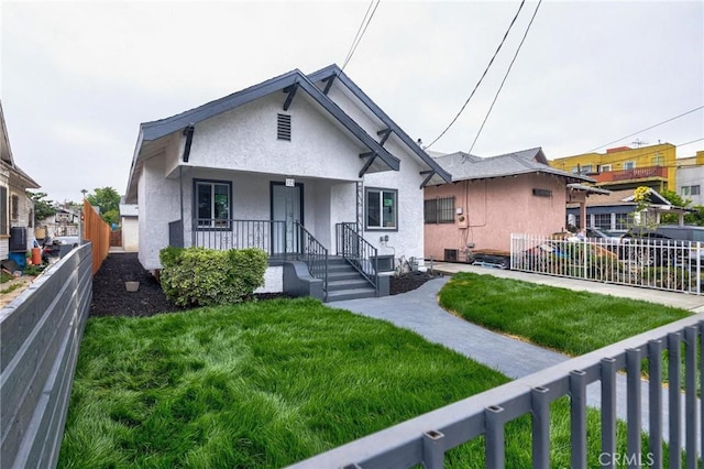 123 W 56th St, Los Angeles, CA 90037 - bungalow with stucco siding and covered porch