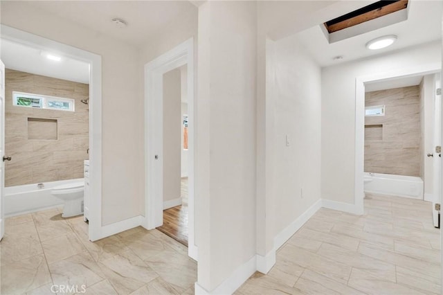 123 W 56th St, Los Angeles, CA 90037 - hallway with light marble finish floors