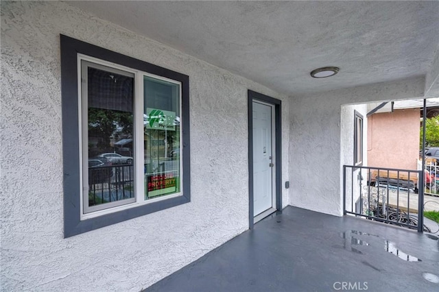 123 W 56th St, Los Angeles, CA 90037 - property entrance with stucco siding