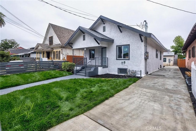 123 W 56th St, Los Angeles, CA 90037 - bungalow-style home featuring stucco siding and driveway