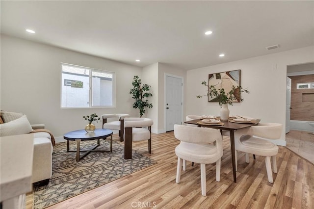 123 W 56th St, Los Angeles, CA 90037 - dining room featuring recessed lighting and light wood-style flooring