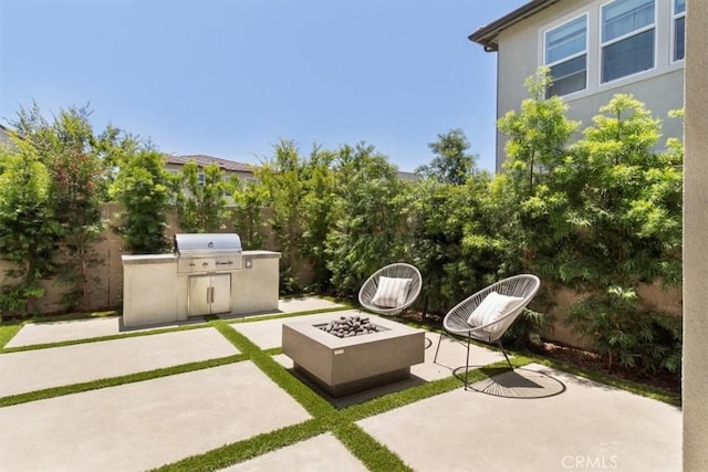 101 Mulberry Dr, Lake Forest, CA 92630 - view of patio / terrace featuring a fire pit and exterior kitchen