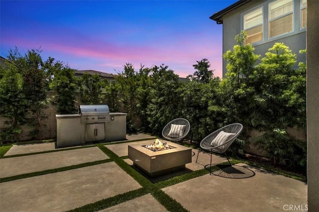101 Mulberry Dr, Lake Forest, CA 92630 - patio terrace at dusk with an outdoor fire pit, a patio, and area for grilling