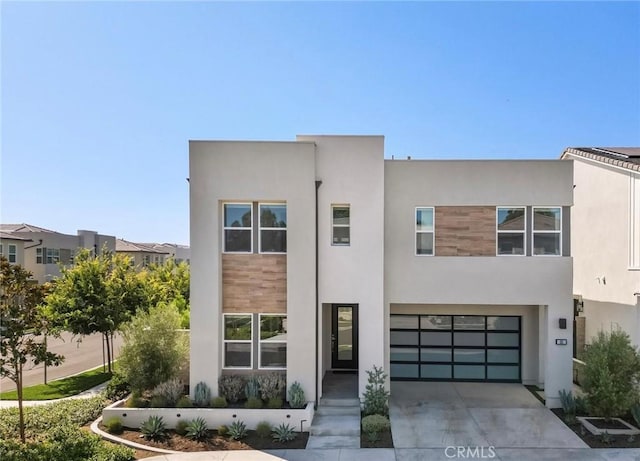 101 Mulberry Dr, Lake Forest, CA 92630 - contemporary house with driveway, stucco siding, and an attached garage
