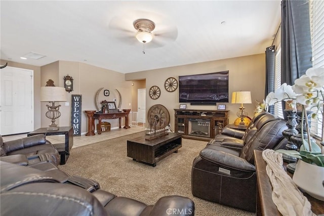863 Legacy Dr, Lemoore, CA 93245 - tiled living area with ceiling fan and carpet floors