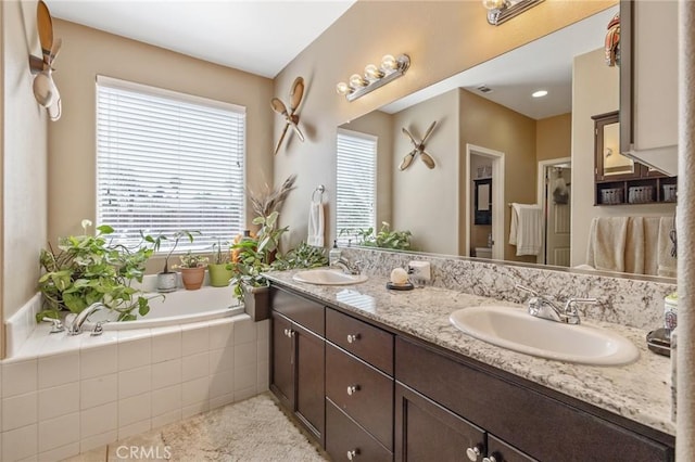 863 Legacy Dr, Lemoore, CA 93245 - bathroom featuring double vanity and a garden tub