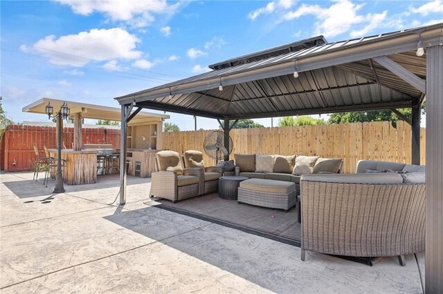 863 Legacy Dr, Lemoore, CA 93245 - fenced backyard with an outdoor living space, a gazebo, and a patio area