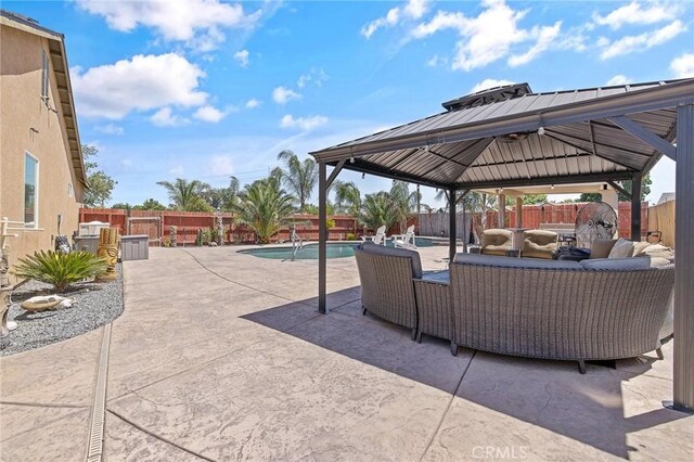 863 Legacy Dr, Lemoore, CA 93245 - fenced backyard with a gazebo, outdoor lounge area, and a patio area