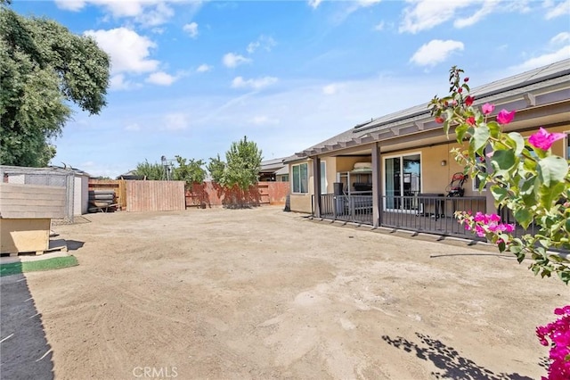 863 Legacy Dr, Lemoore, CA 93245 - fenced backyard with a patio area