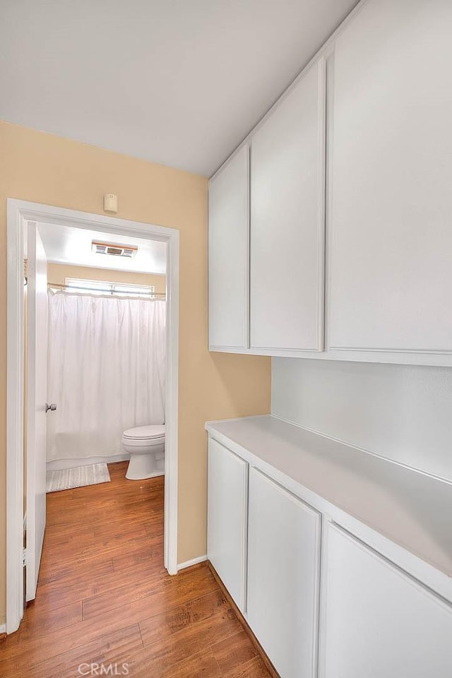 1842 Fern Hollow Dr, Diamond Bar, CA 91765 - bathroom featuring wood finished floors and curtained shower