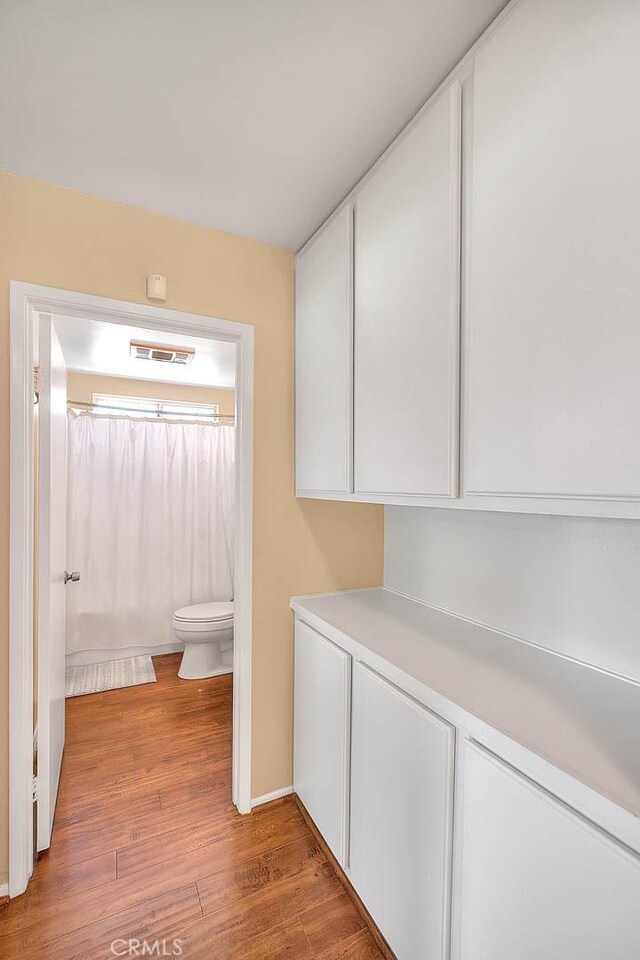 1842 Fern Hollow Dr, Diamond Bar, CA 91765 - bathroom featuring wood finished floors and curtained shower
