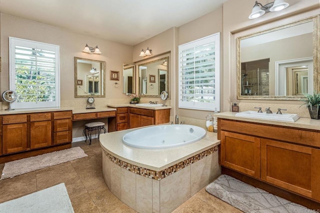 5146 Delaney Ct, Carlsbad, CA 92008 - bathroom featuring a tub with jets, plenty of natural light, two vanities, and tile patterned flooring