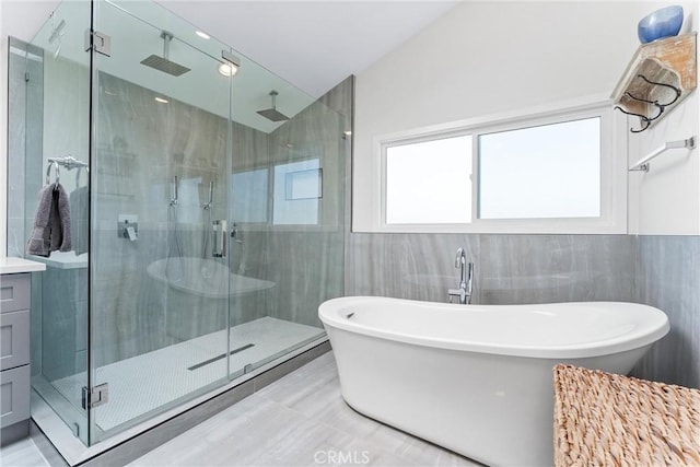 3208 Calle Grande, San Clemente, CA 92672 - full bath featuring tile walls, a stall shower, a freestanding tub, vanity, and vaulted ceiling