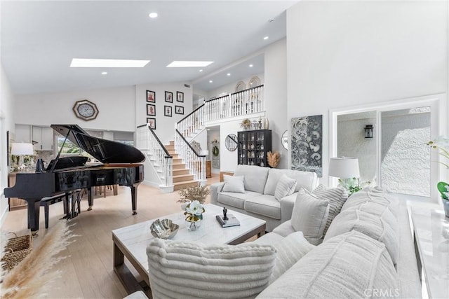 3208 Calle Grande, San Clemente, CA 92672 - living area featuring a skylight, high vaulted ceiling, stairs, wood finished floors, and recessed lighting