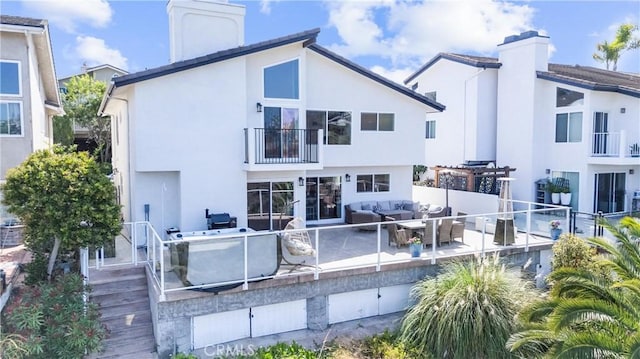 3208 Calle Grande, San Clemente, CA 92672 - rear view of property with a chimney, a balcony, outdoor lounge area, and stucco siding