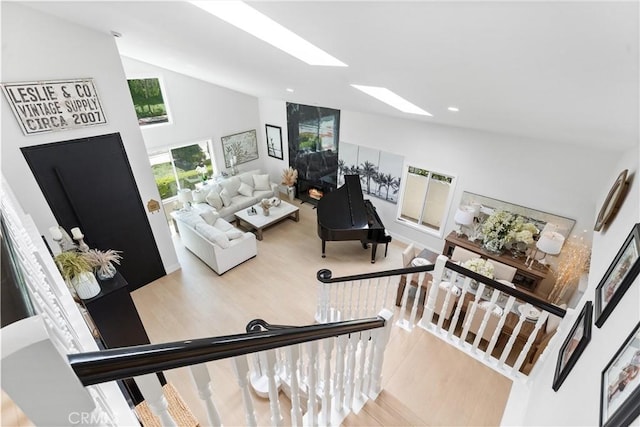 3208 Calle Grande, San Clemente, CA 92672 - living area featuring a skylight, high vaulted ceiling, and wood finished floors