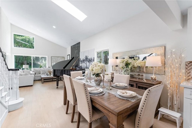 3208 Calle Grande, San Clemente, CA 92672 - dining area with high vaulted ceiling, stairway, a skylight, and light wood-style floors