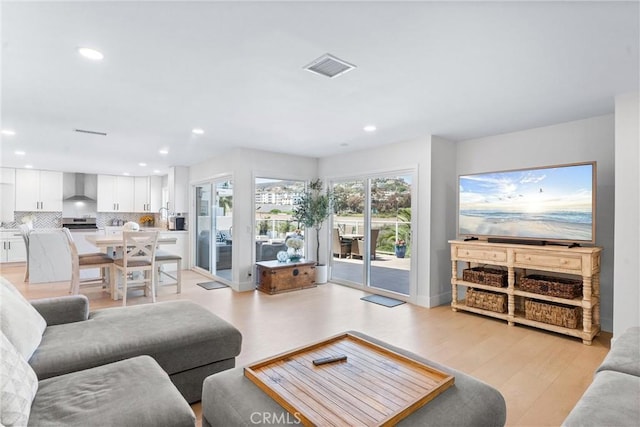 3208 Calle Grande, San Clemente, CA 92672 - living room featuring recessed lighting and light wood-type flooring