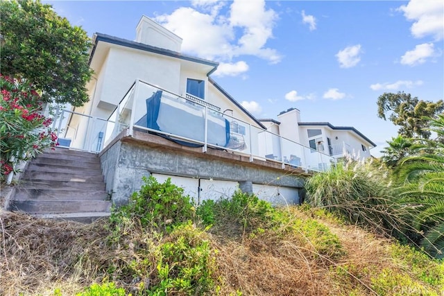 3208 Calle Grande, San Clemente, CA 92672 - back of house with stucco siding, a chimney, and stairway