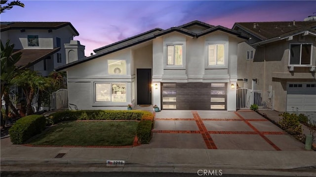 3208 Calle Grande, San Clemente, CA 92672 - view of front facade featuring stucco siding, a garage, driveway, and a gate
