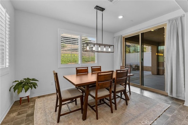 2694 Kings Canyon Dr, Jurupa Valley, CA 92509 - dining room featuring plenty of natural light, recessed lighting, and stone finish flooring