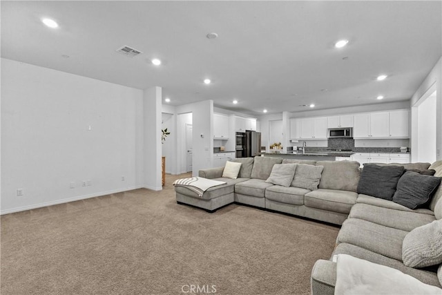 2694 Kings Canyon Dr, Jurupa Valley, CA 92509 - living room featuring recessed lighting and light colored carpet